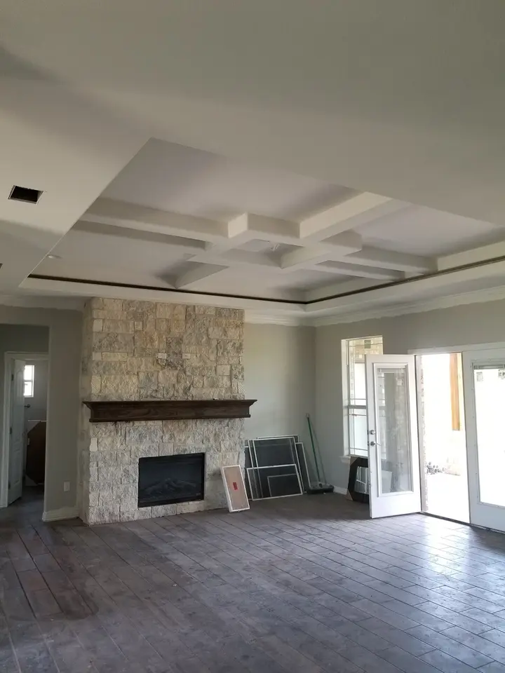 Coffered ceiling and stone fireplace
