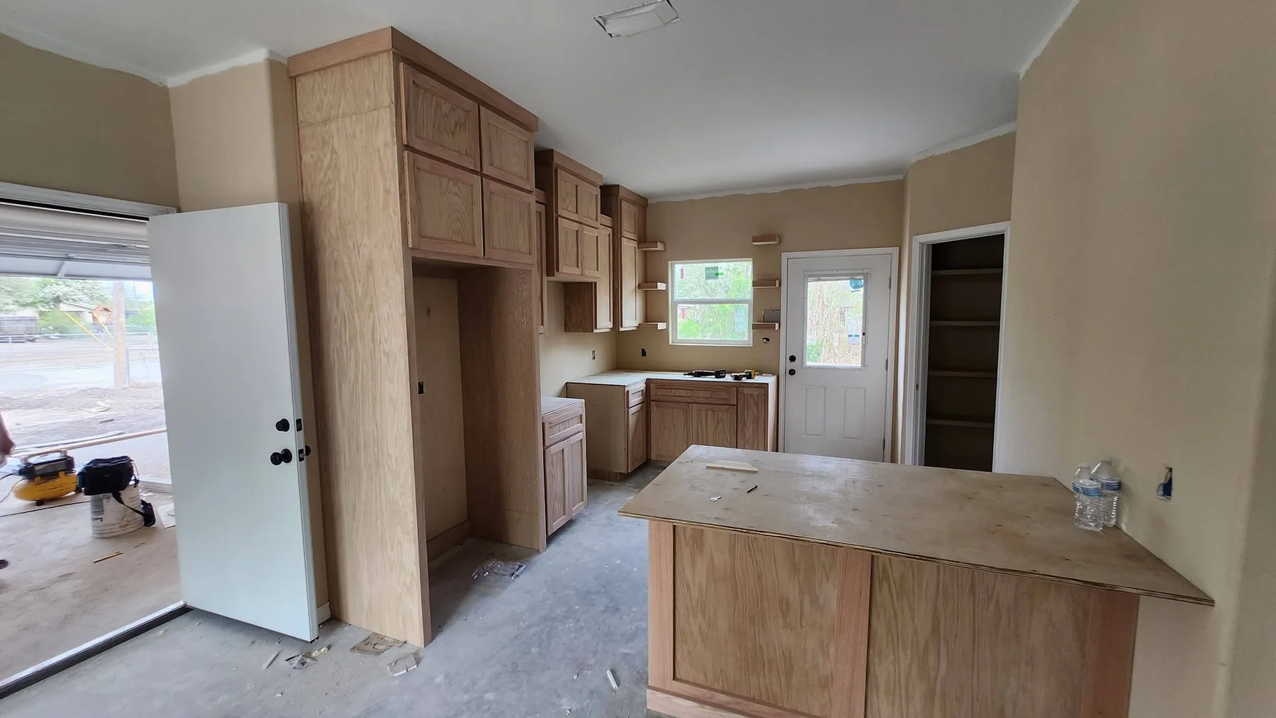 Custom cabinetry and kitchen installation during home construction in Alice, Texas